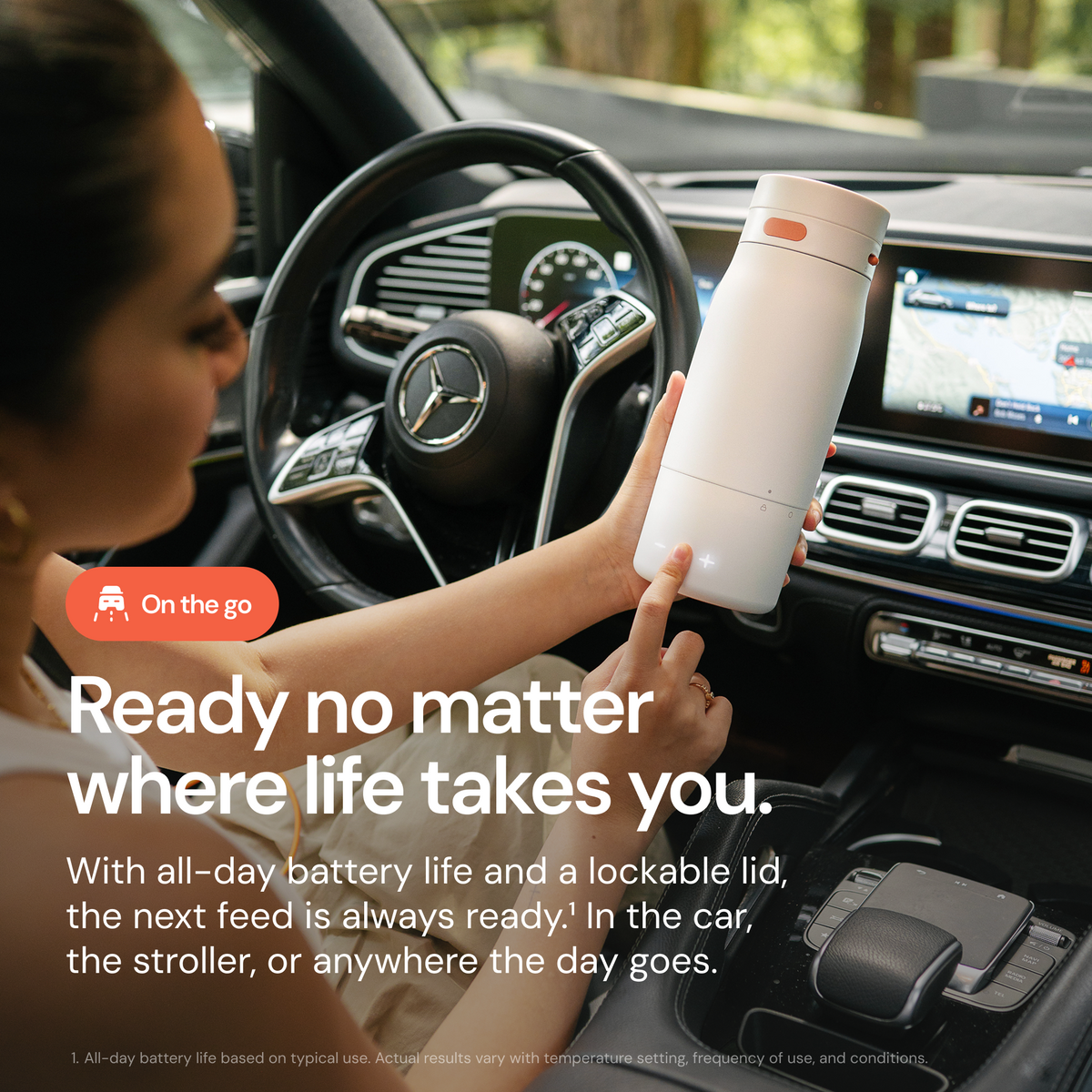 BuubiBottle Portable Milk Warmer PRO in a car travel setting with on-the-go feeding message