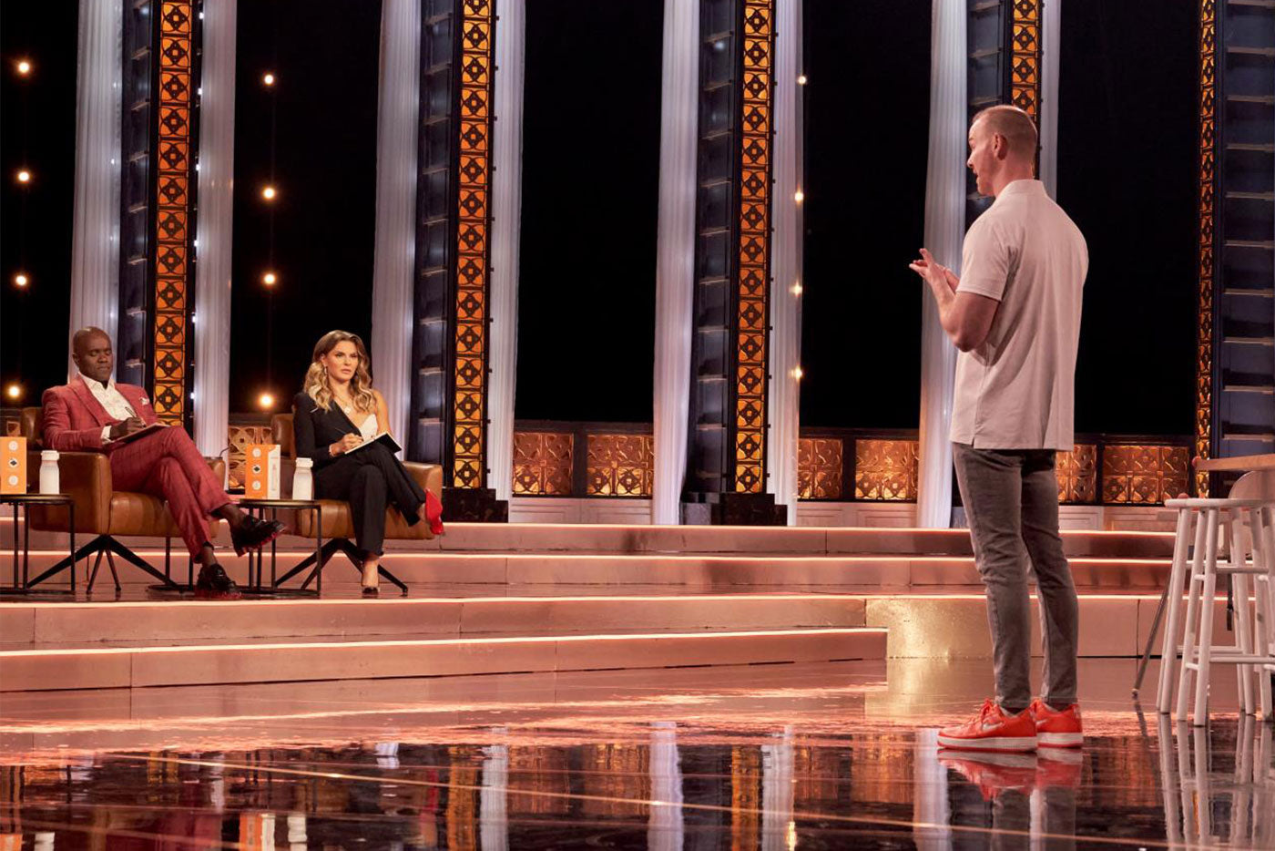 Quark Baby founder pitching on Dragons' Den stage with investors seated