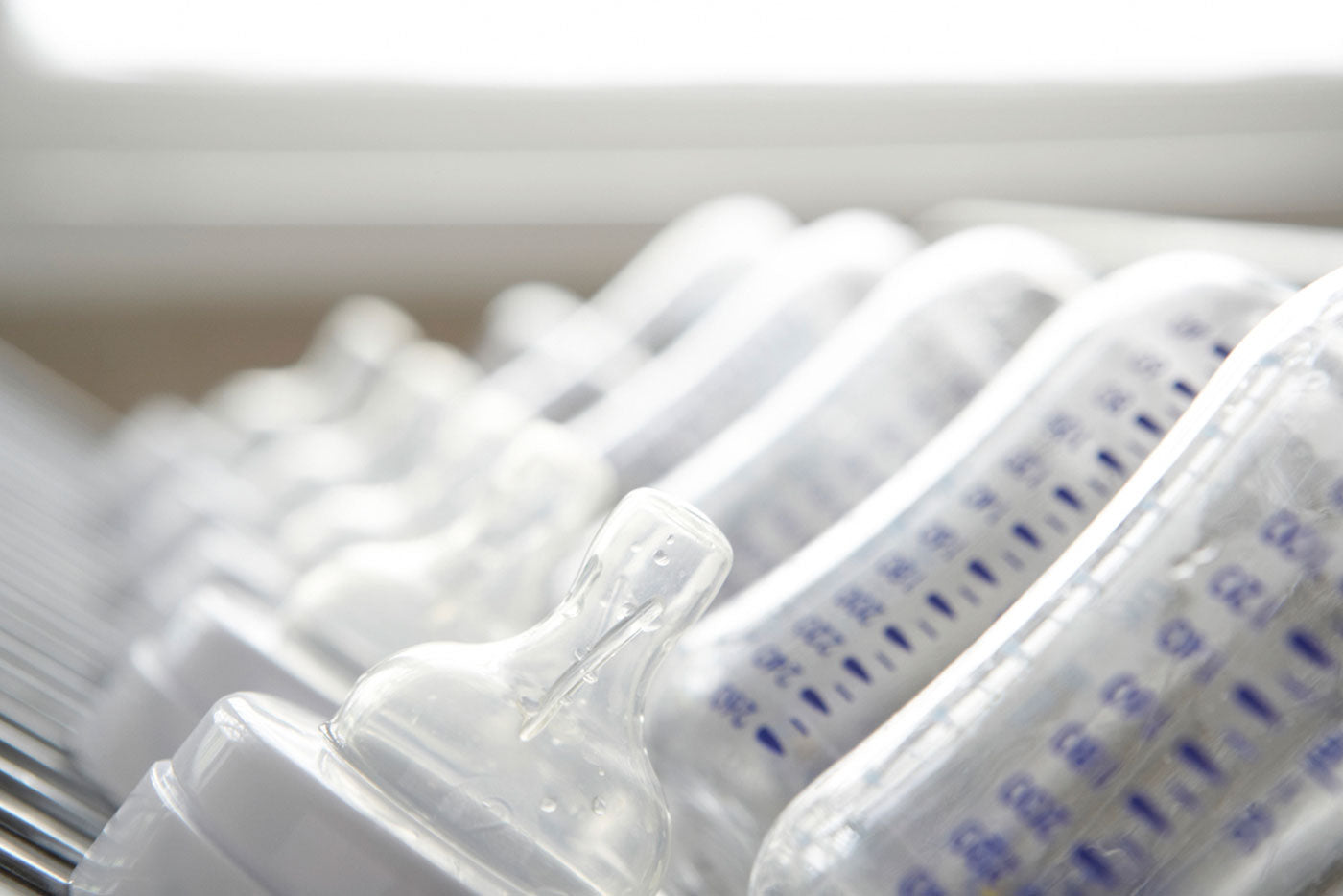 Quark Baby bottles arranged in row, editorial health and safety blog cover
