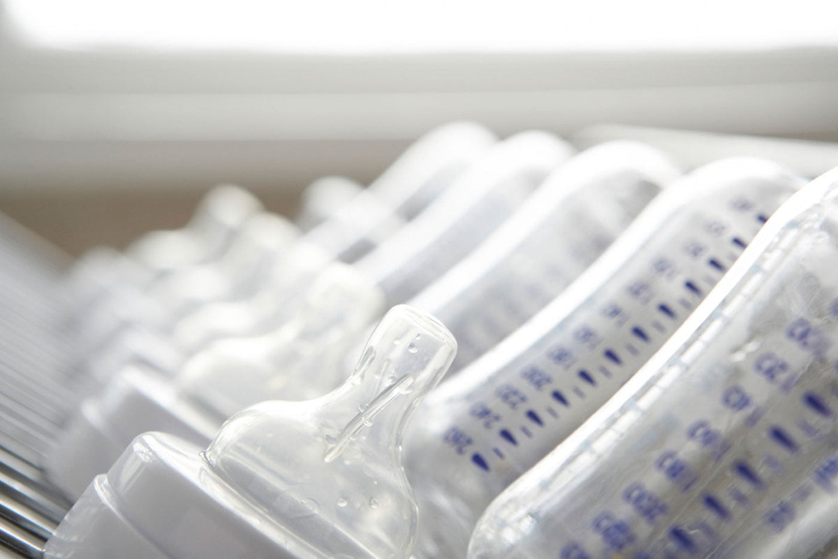 Quark Baby bottles arranged in row, editorial health and safety blog cover