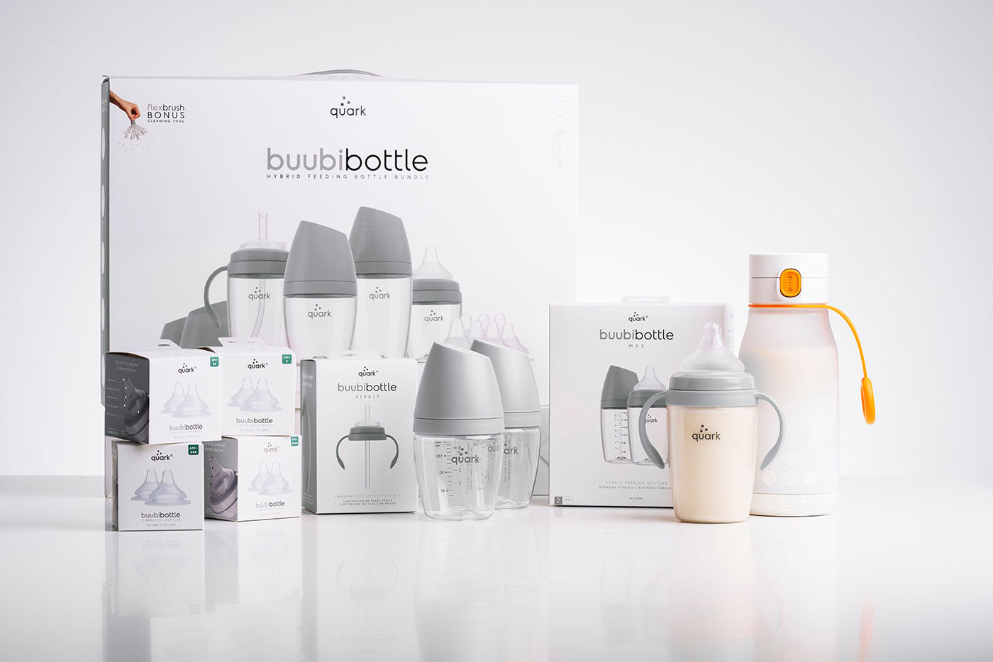 Quark Baby BuubiBottle collection with bottles, warmer, and feeding accessories displayed together.