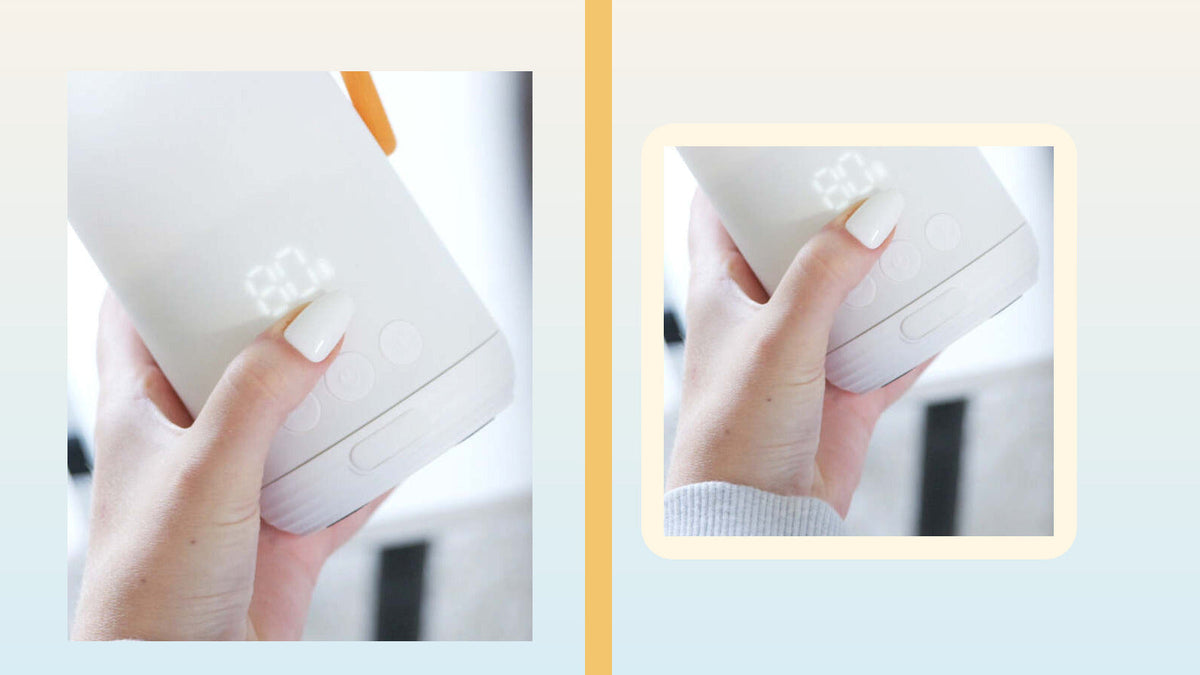 Hand holding the BuubiBottle Portable Milk Warmer PRO with its illuminated display