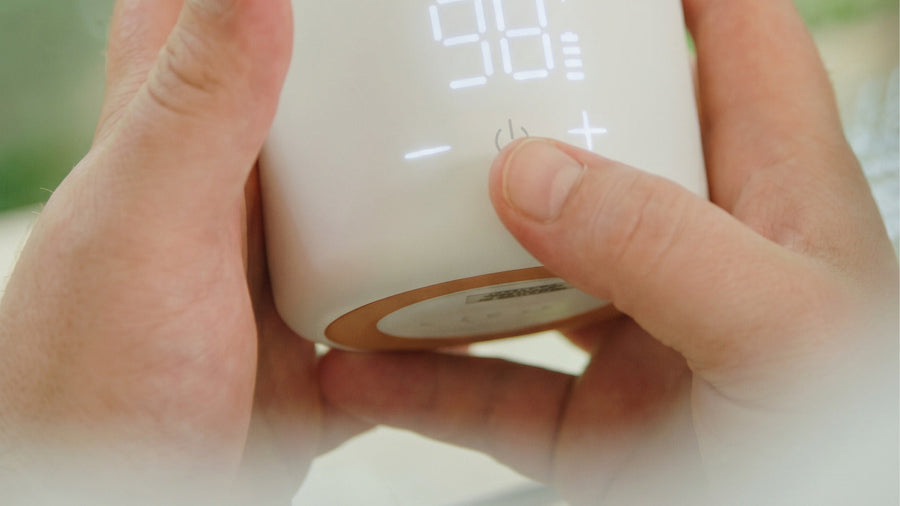 Close-up of the BuubiBottle Portable Milk Warmer PRO touch controls and illuminated display