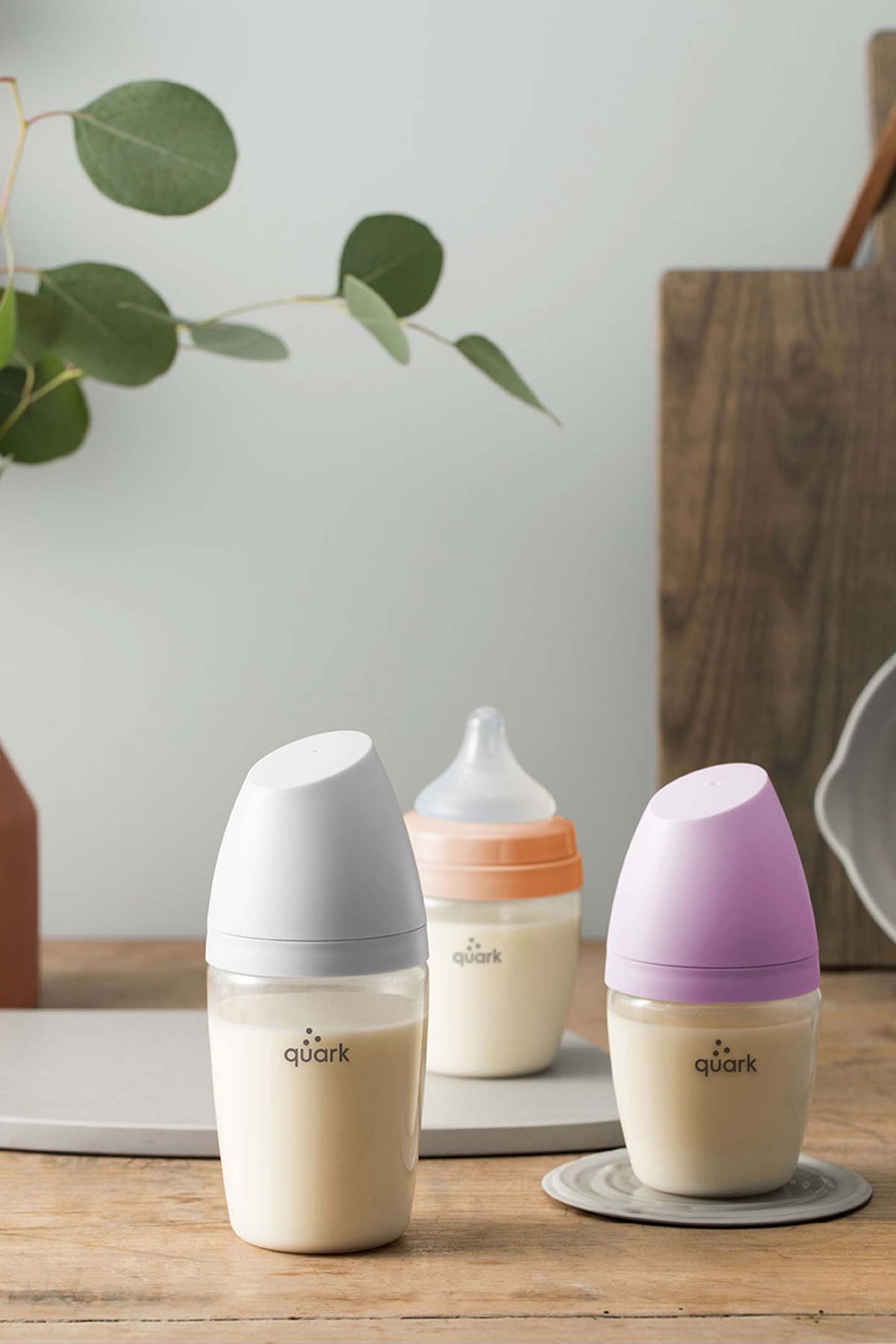 BuubiBottle Starter Set and Smart Portable Milk Warmer — newborn feeding bundle shown in grey, orange, and purple bottle colour options