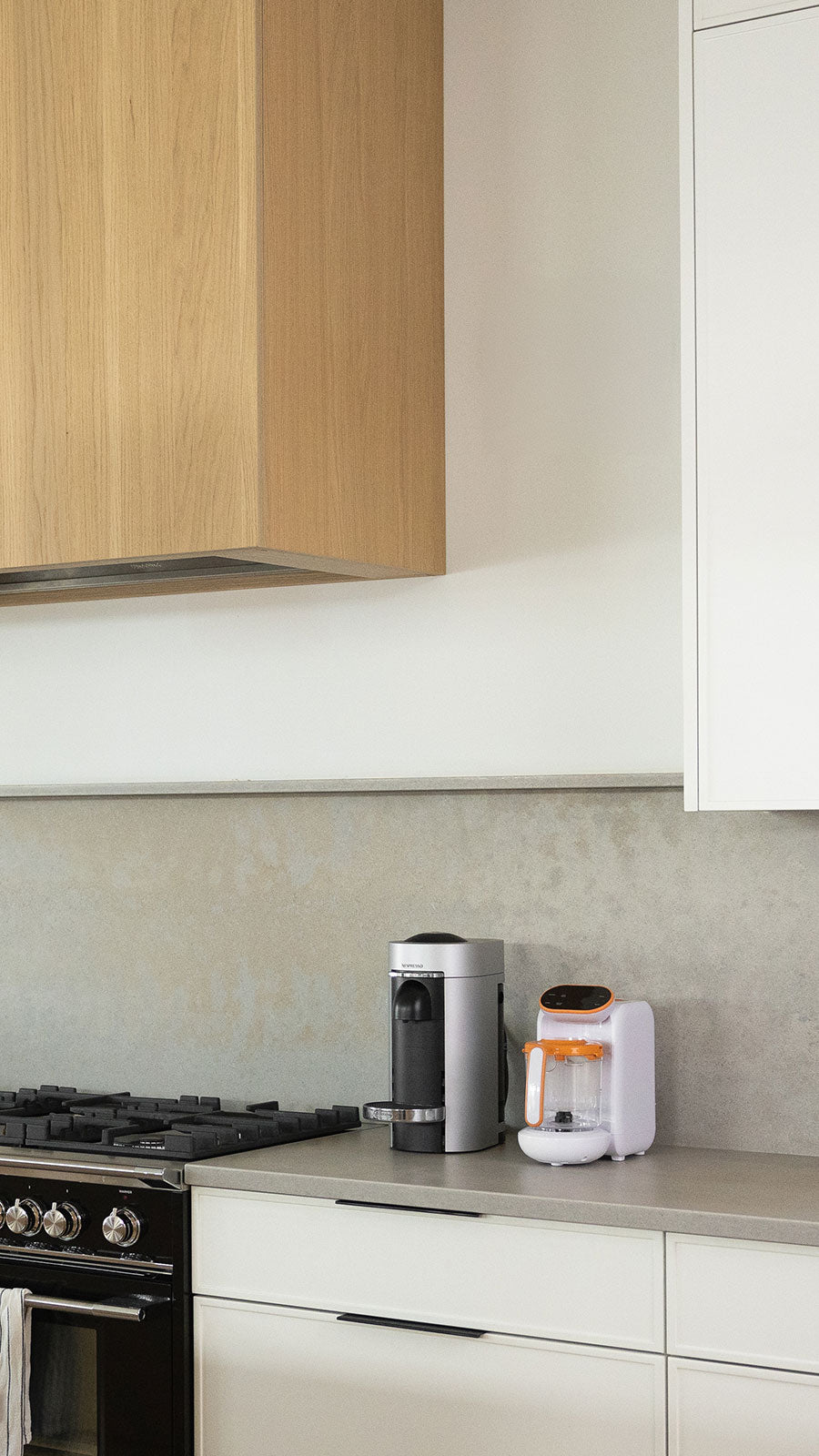 Quark Feeding Essentials Bundle on kitchen counter with bottle warmer and food maker.