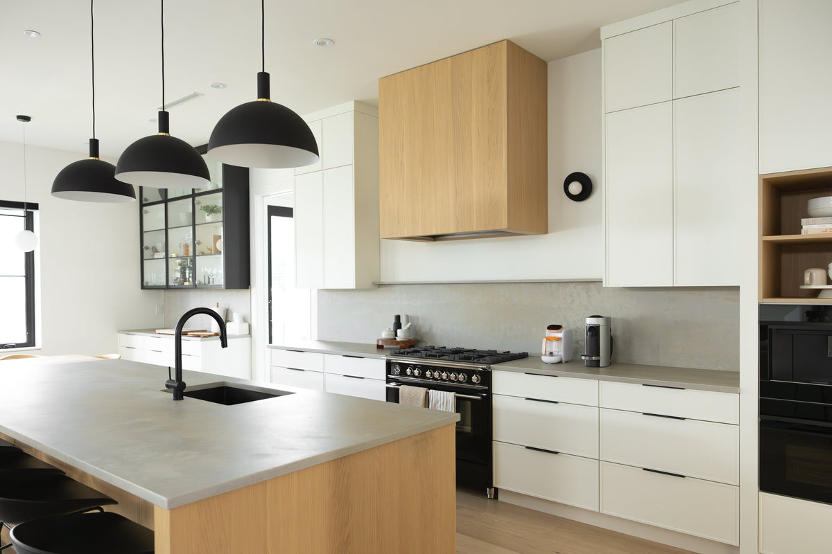 Modern kitchen with organized storage and clean countertops for busy parents using Quark Baby solutions