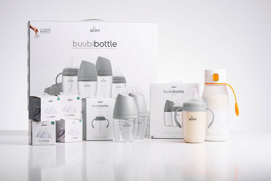 Quark Baby BuubiBottle collection with bottles, warmer, and feeding accessories displayed together.