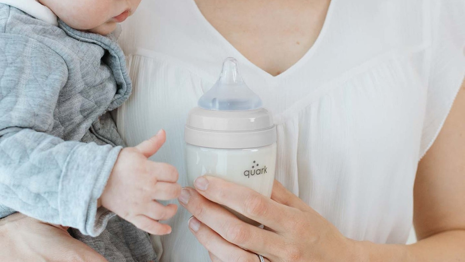 Parent feeding newborn with anti-colic BuubiBottle and RealFeel nipple