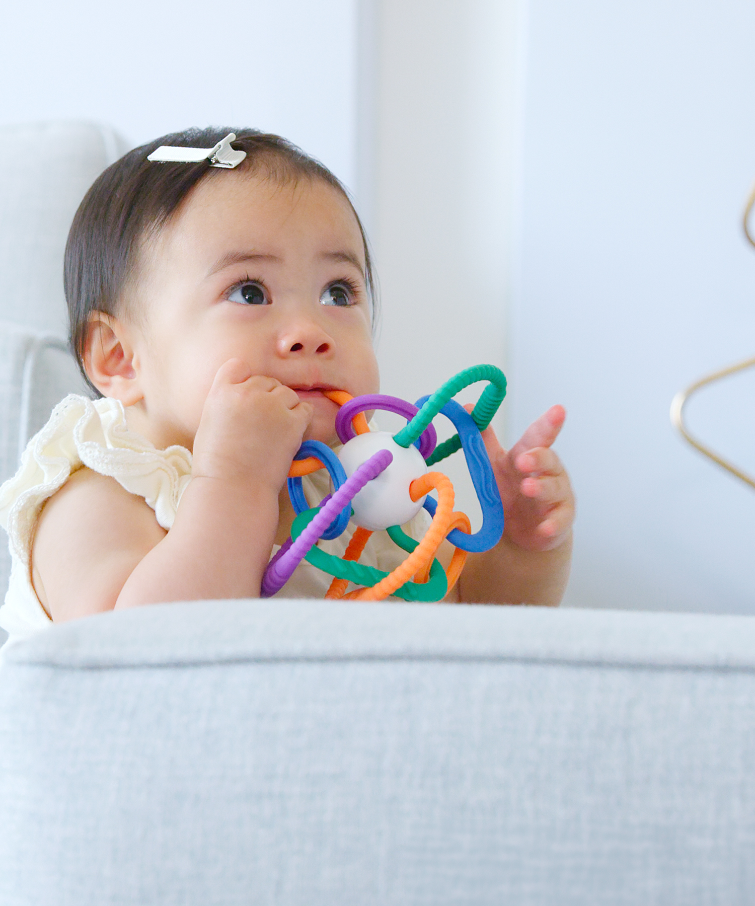 Quark Baby Playblock colorful teething toy, infant sensory play toy with handles.
