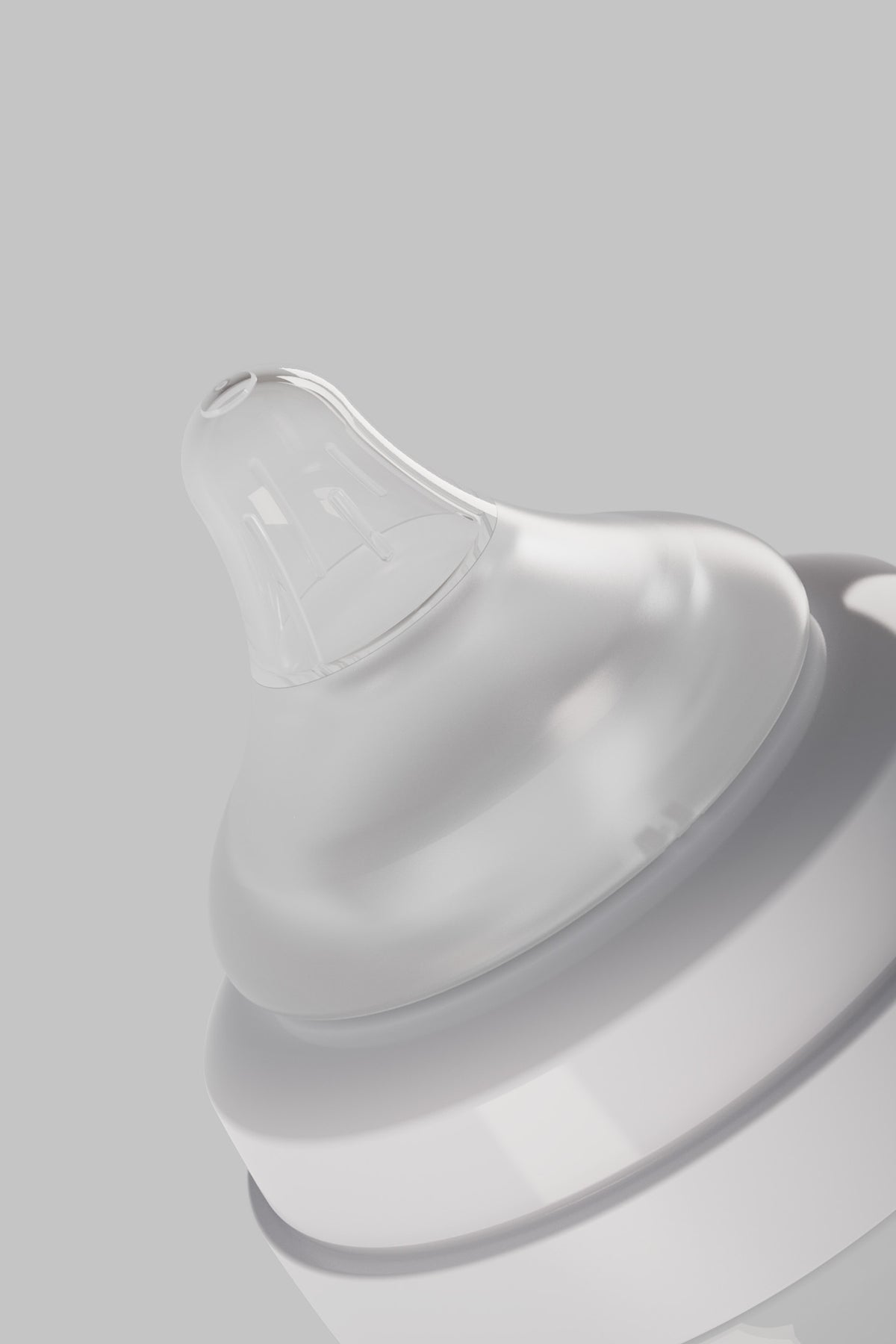 RealFeel bottle nipple close-up — anatomical breast-shaped silicone design with soft texture zones for natural latch, anti-vacuum venting