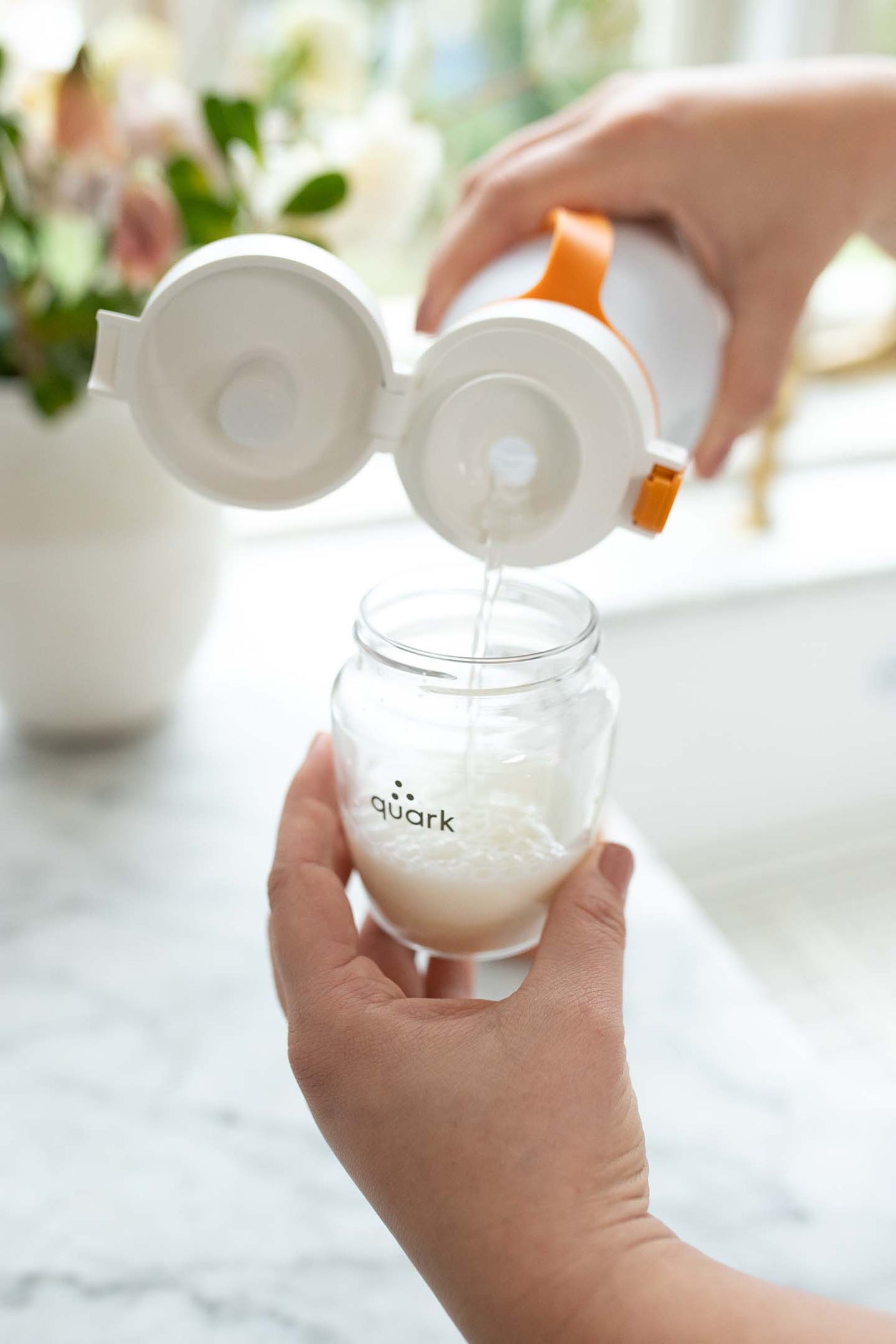 Quark Baby BuubiBottle portable milk warmer used for travel feeding context