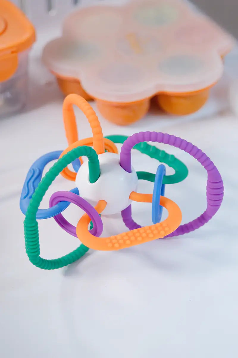 Quark Thiingy colorful sensory teether with textured rings and handles, close-up detail view